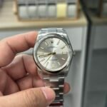 Rolex Oyster Perpetual 41mm Silver Sunburst Dial (Gold Accents) Smooth Bezel Oyster Bracelet (124300) DD3230 Movement